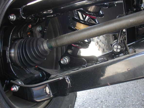 On Stage 2, Stage 4, and Stage 5 models the rebound adjuster located on lower eyelet of the shocks should be oriented towards the rear of the vehicle, as shown. (Left side shown ). If needed, you can turn the lower eyelet to orient properly.
