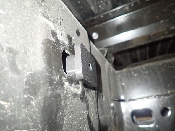 Remove the plastic caps on the outside and inside of the frame. (right side shown).