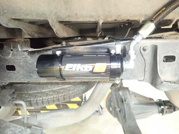 Ensure hose is closer possible to the frame and is not overbend or twisted. Note that the shock can be rotated to point hose fiting closer to the frame.