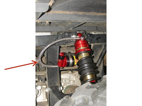 Install the Elka shock absorbers bolting the top mount first with the banjo bolt (connected to the shock head) facing towards the outside of the vehicule.  Orient the hose towards the rear of the vehicule.  Make sure to keep the driver’s side reservoir away from the exhaust pipe.