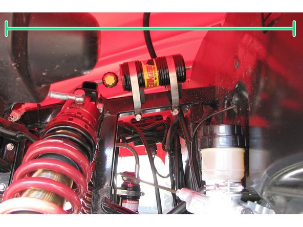 Install the Elka shock absorbers bolting the top mount first with the banjo bolt (connected to the shock head) facing towards the outside of the vehicule.  Orient the hose towards the front of the vehicule.