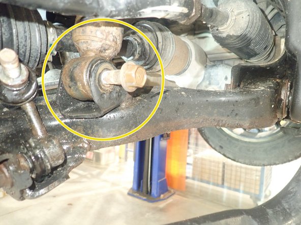 Remove lower bolts from OEM shocks. Keep OEM bolts to install Elka shocks.