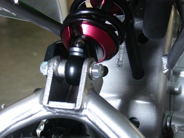 On Stage 2 models the rebound adjuster located on lower eyelet of the shocks should be oriented towards the rear of the vehicle, as shown. If needed, you can turn the lower eyelet to orient properly.