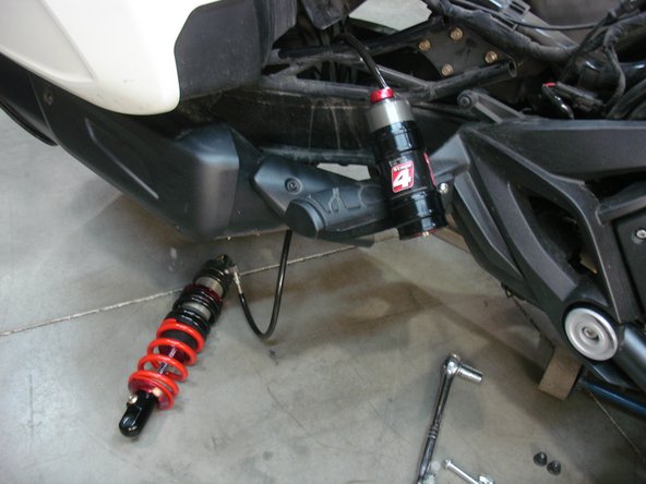 On Stage 1 and Stage 2, the shock must be installed with the shraeder nitrogen valve at the top of vehicle. The shraeder valve also must be installed facing the rear of vehicle.