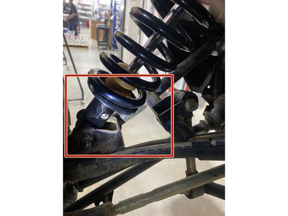 On Stage 2, Stage 4 and Stage 5 models, the lower shock eyelets should be installed with the rebound adjuster (red square) oriented towards the back of the vehicle as shown by the Red square on the photo ( left side shown ). If needed, you can turn the lower eyelet to orient properly.