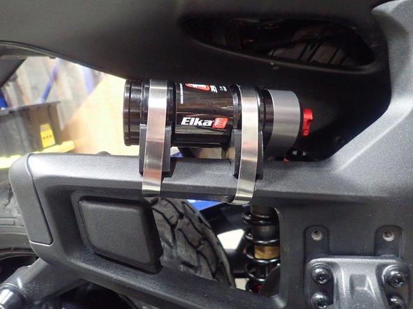 Using supplied rubber mounting kit, attach the reservoir as shown.
