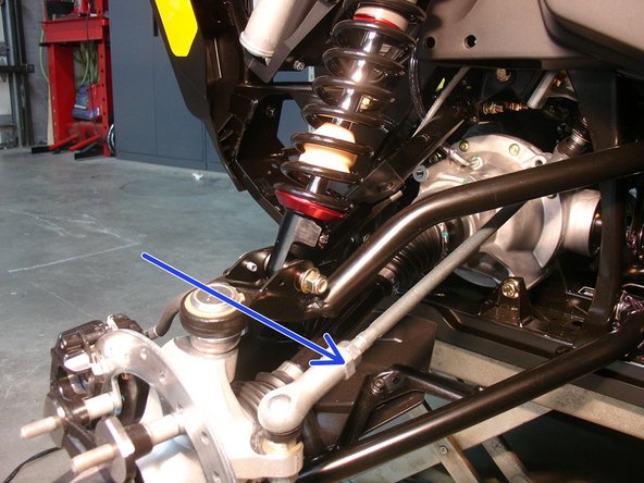 On Stage 2, Stage 4 and Stage 5 models, the lower shock eyelets should be installed with the rebound adjuster oriented towards the rear of the vehicle as shown by the blue Arrow on the photo ( left side shown ). If needed, you can turn the lower eyelet to orient properly.