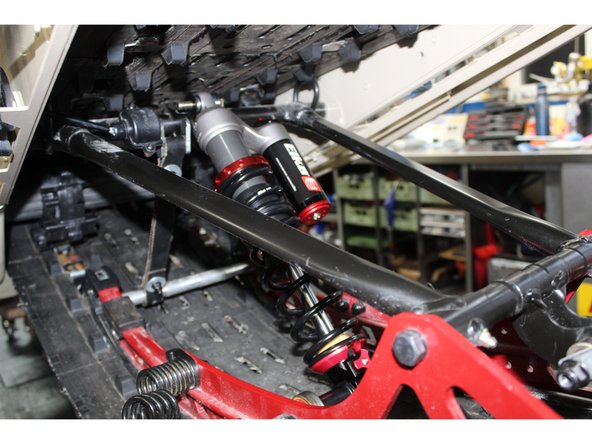 Reinstall the lower shaft on the center Elka shock in the reverse order it was remove.