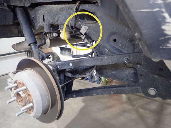 Remove the bolt that hold the brake line (showed by yellow circle) on each side to ensure that it will not be damaged and stretched during installation.