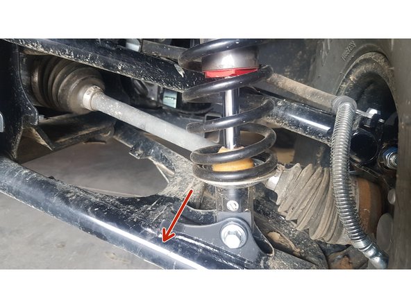 On Stage 2, Stage 4, and Stage 5 models the rebound adjuster located on lower eyelet of the shocks should be oriented towards the rear of the vehicle, as shown. (Left side shown ). If needed, you can turn the lower eyelet to orient properly.