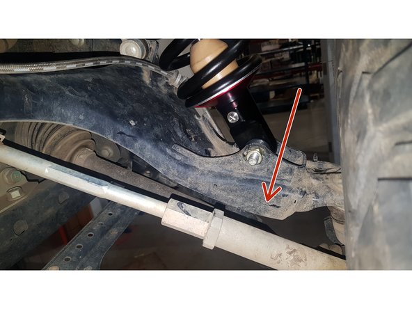 On Stage 2, Stage 4 and Stage 5 models, the lower shock eyelets should be installed with the rebound adjuster oriented towards the rear of the vehicle as shown by the blue Arrow on the photo ( right side shown ). If needed, you can turn the lower eyelet to orient properly.