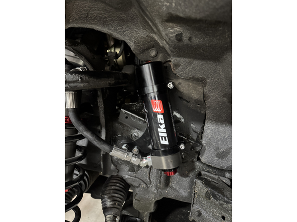 Reinstall the lower bolt and torque to OEM spec