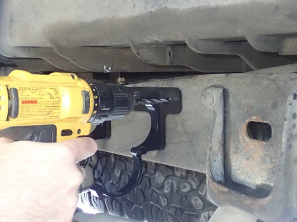 After this bolt is tighten, drill a 10mm hole (7/16") in the frame to secure bracket with the provided nylon-lock bolt. MAKE SURE YOUR LOCAL REGULATIONS AND YOUR MANUFACTURER'S WARRANTY ALLOW YOU TO MODIFY THE FRAME OF YOUR VEHICLE BEFORE DRILLING IT.