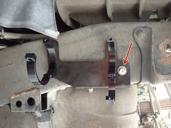 On the left side, use lower existing bolt to fix bracket, and use provided nylon-lock bolt in the existing hole to secure it.