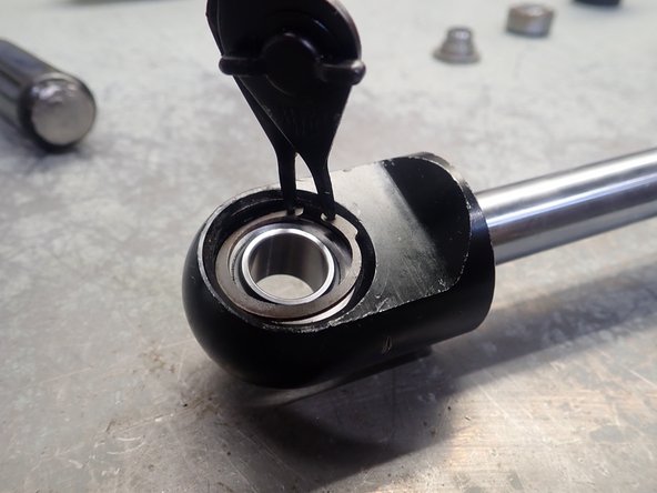 Install the second new circlip in the other shock's end groove. Make sure the clip is properly seated in its groove.