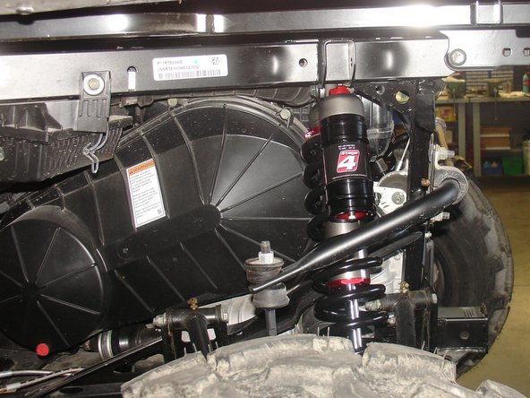 Install the rear new Elka shocks with the reservoir ( on Stage 3-4-5 ) or Schraeder nitrogen valve ( on Stage 1-2 ) at the top of vehicle. ( left side shown ).