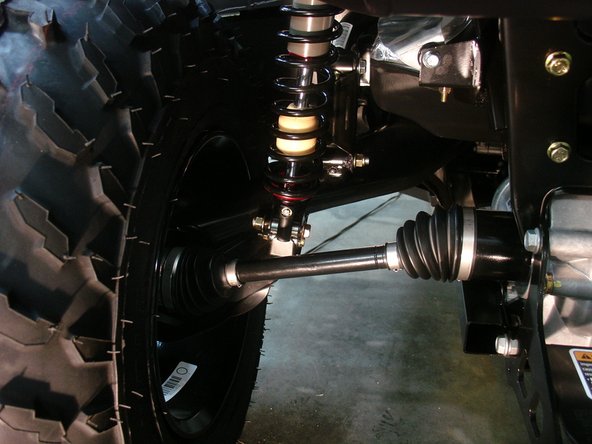 On Stage 2, Stage 4, and Stage 5 models the rebound adjuster located on lower eyelet of the shocks should be oriented towards the rear of the vehicle, as shown. (Left side shown ). If needed, you can turn the lower eyelet to orient properly.