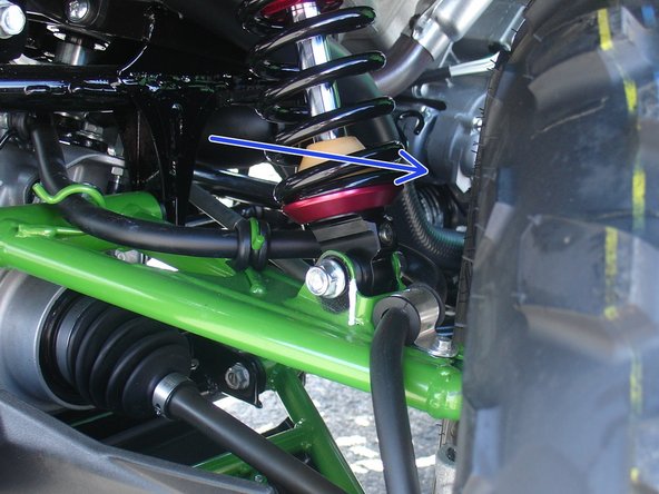 On Stage 2, Stage 4 and Stage 5 models, the lower shock eyelets should be installed with the rebound adjuster oriented towards the outside of the vehicle as shown by the blue Arrow on the photo ( left side shown ). If needed, you can turn the lower eyelet to orient properly.