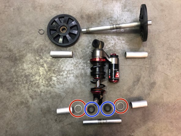 Lift the rear of the snowmobile in such a way that the track is not touching the ground.