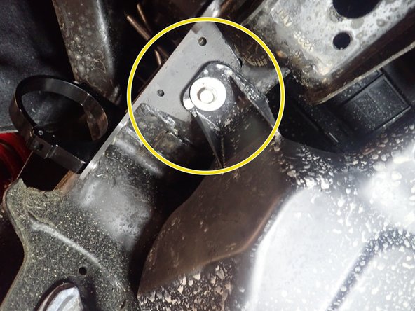 Remove this bolt, slide the reservoir bracket between frame and plastic protector then screw the bolt in the center hole of bracket as shown by yellow circle.