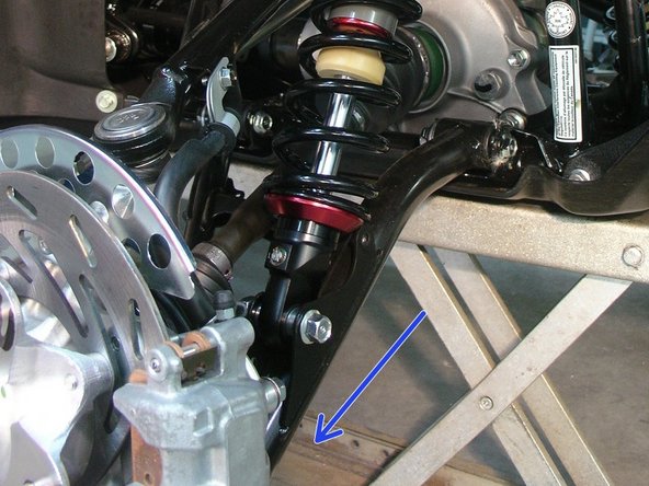 On Stage 2, Stage 4 and Stage 5 models, the lower shock eyelets should be installed with the rebound adjuster oriented towards the outside of the vehicle as shown by the blue Arrow on the photo ( right side shown ). If needed, you can turn the lower eyelet to orient properly.