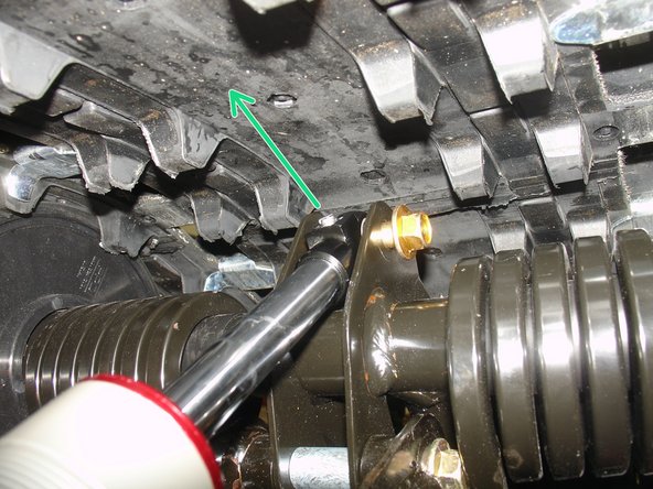 Turn Elka eyelet to orient the rebound adjuster upper side ( as shown by green Arrow ). Install eyelet with supplied sleeve and plastic spacers.