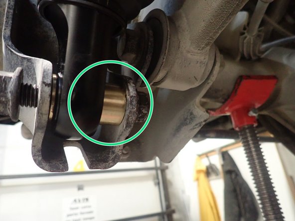 Install upper bolts, then adjust rear axle height with underhoist, then install lower bolts.