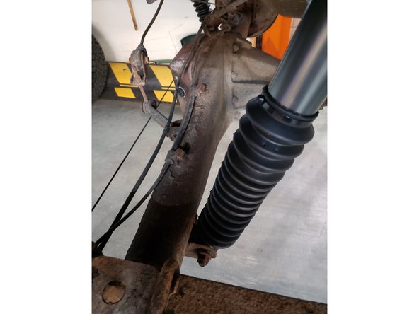 Remove upper and lower bolts from OEM shocks