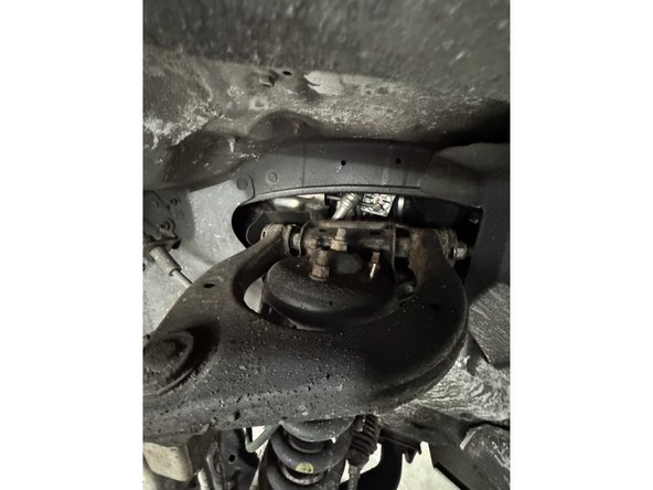 Remove the 3 nuts of the upper shock.