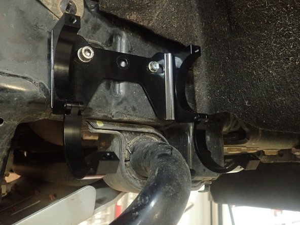 Insert a provided square spacer in the frame's inside hole as shown.