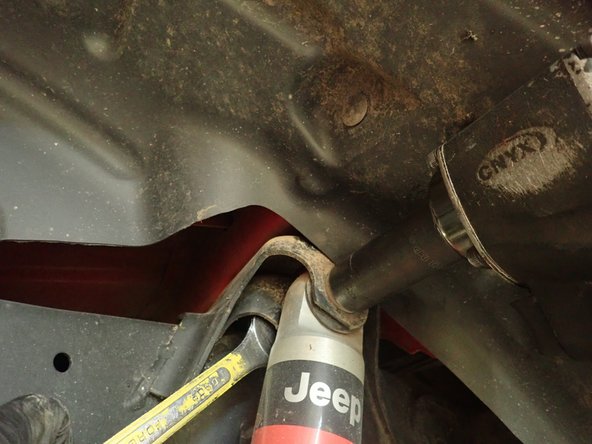 Remove upper and lower shock bolts, then remove OEM shocks.