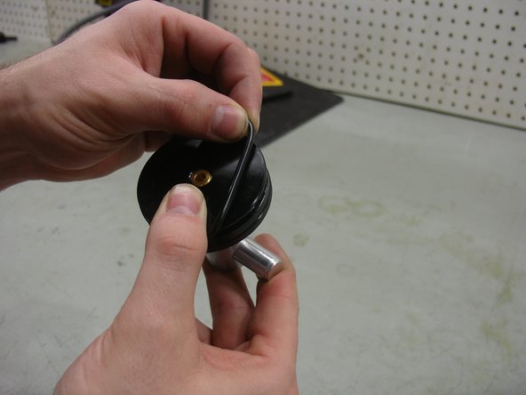 Place the new O-ring (OR49x3) into groove as shown in first picture, and hold it firmly with your thumb to avoid twisting during installation.