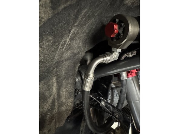 Make sure the hose doesn't touch the brake line braket.