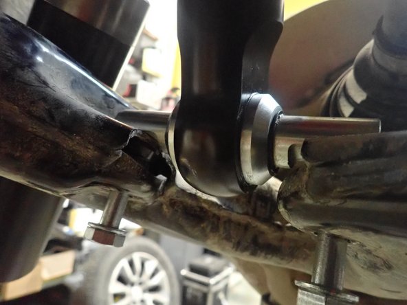 Start installation with the provided lower bolts and washers. Apply threads locker on bolts, then torque them at 50 ft.lb.