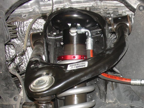 The hose fitting must face outside the vehicle. The hose must  facing front of vehicle (right side shown).