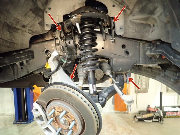 Loosen upper arm and lower arm bolts to help moving them to get out front shocks.