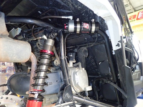 Spot the location for the reservoir installation on the attached picture. (right side shown)