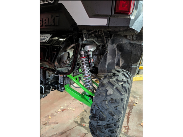 Install piggyback shock with the reservoir upward and facing outside of the vehicle.