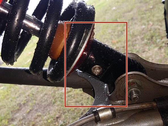 On Stage 2, Stage 4 and Stage 5 models, the lower shock eyelets should be installed with the rebound adjuster (red square) oriented towards the back of the vehicle as shown by the Red square on the photo ( Right side shown ). If needed, you can turn the lower eyelet to orient properly.