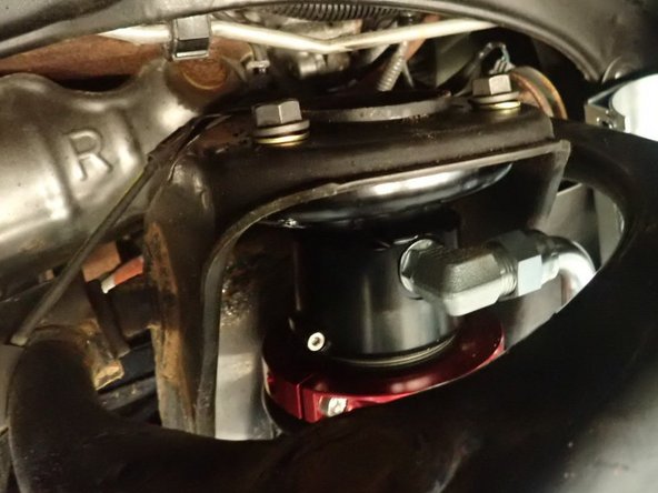 Install 3 supplied upper bolts and washers but don't fully tighten them.