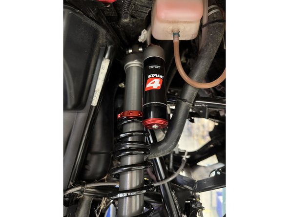 Install the reservoir facing the front of the UTV as shown.