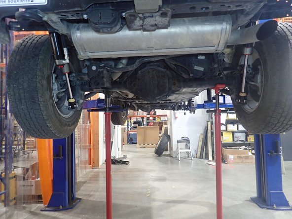 Supporting the lower rear axle is recommended to remove tension on the shock absorber attachment points.