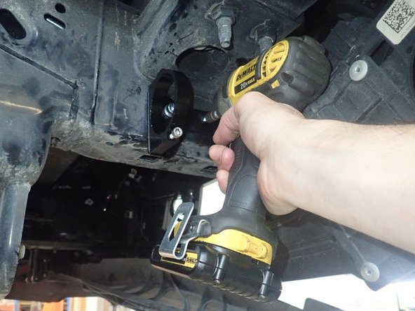 Orienting the bracket assembly as horizontally as possible, use the supplied self-taping screw to secure the bracket in the center bracket hole.