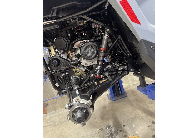 On Stage 2, Stage 4 and Stage 5 models, the lower shock eyelets should be installed with the rebound adjuster oriented towards the rear of the vehicle ( right side shown ). If needed, you can turn the lower eyelet to orient properly.