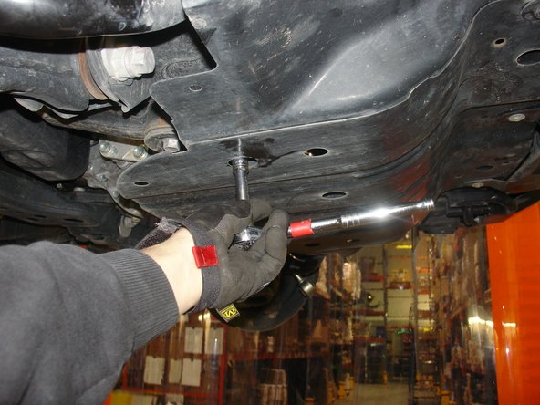 Remove front skid plate to have access to sway bar supports.