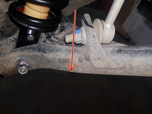 On Stage 2, Stage 4, and Stage 5 models the rebound adjuster located on lower eyelet of the shocks should be oriented towards the FRONT of the vehicle, as shown. (Right side shown ). If needed, you can turn the lower eyelet to orient properly.