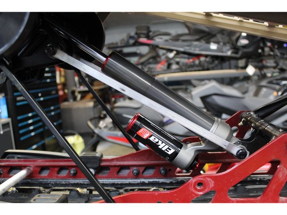 Remove the rear shock according to the procedures recommended by the manufacturer.