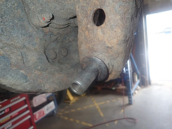 Clean lower studs from rust if needed, and apply small amount of grease or anti-seize on it.