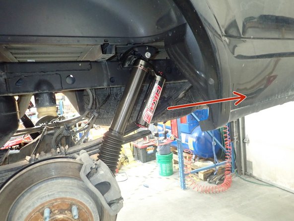 Remove upper and lower shocks bolts and remove oem shocks.