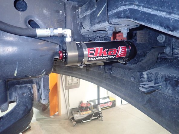 Install reservoirs as shown, making sure the hose is not rubbing anywhere and do not overbend it.